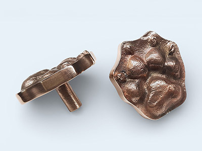 a pair of bronze Pet-Paw cabinet knobs